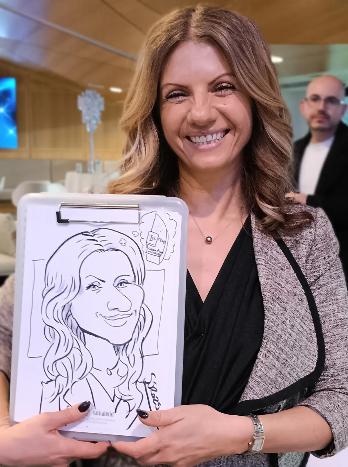 Woman smiling and holding her caricature on a clipboard